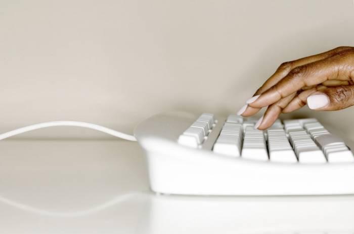 Woman Typing on Keyboard