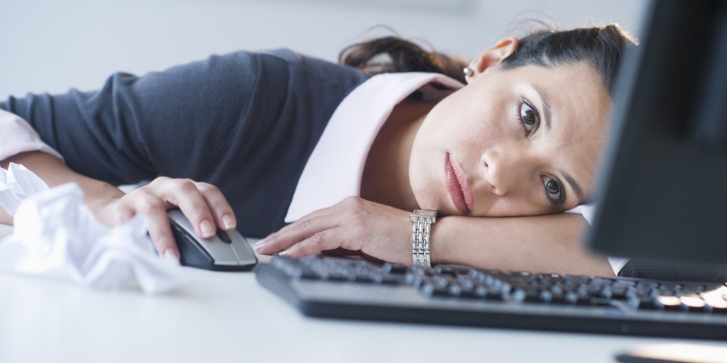 USA, New Jersey, Jersey City, Businesswoman in front of computer, looking tired