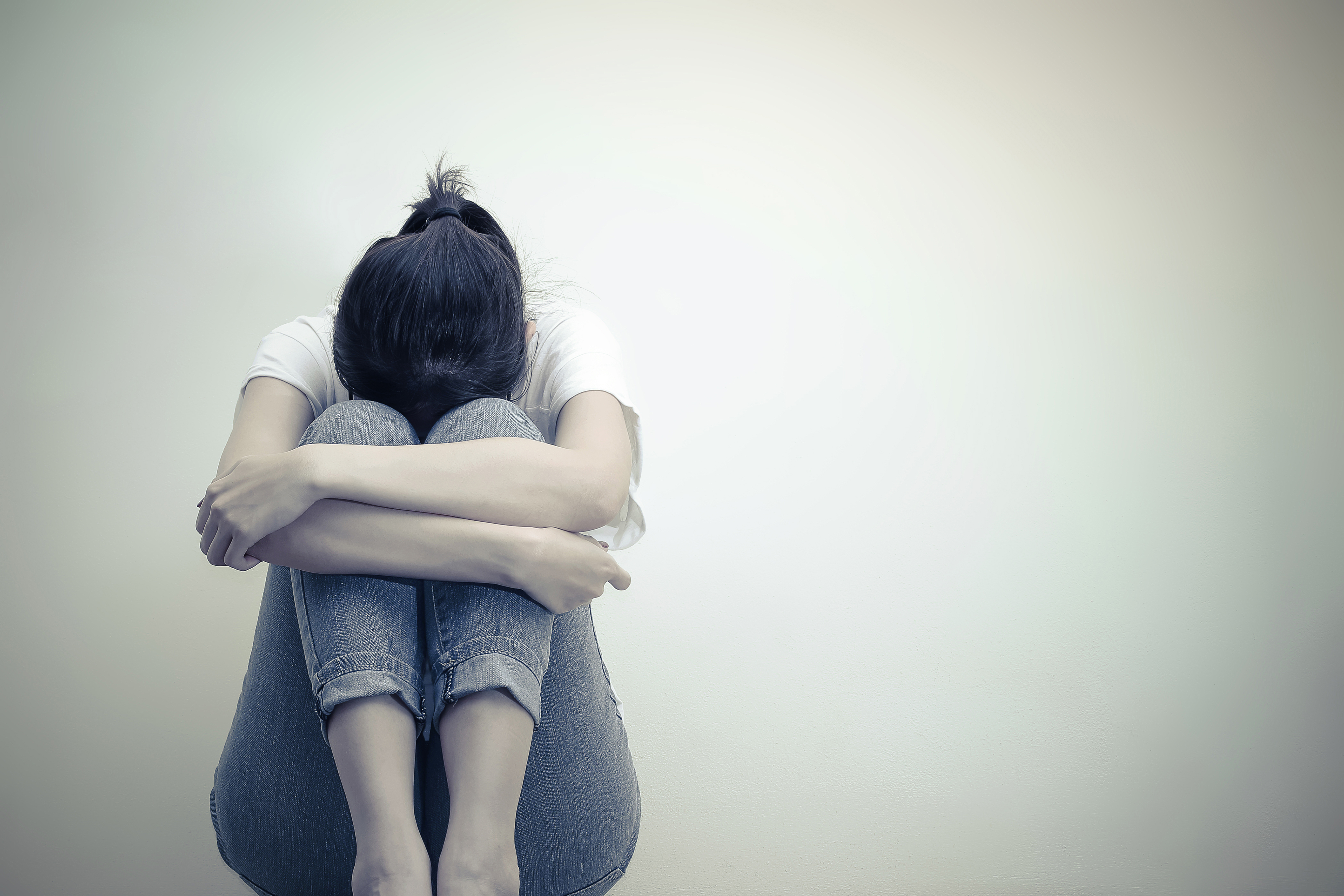 A Depressed Girl Sitting Down